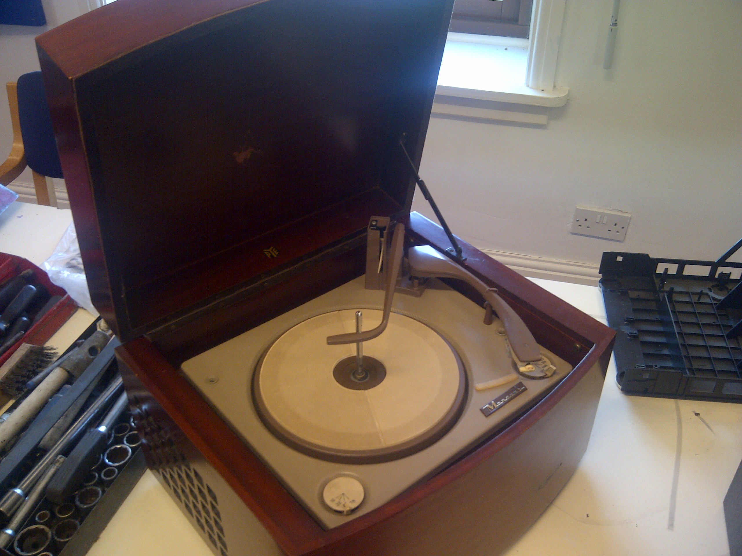 This record player had been rescued from a tip by a relative of the guy who brought it in.