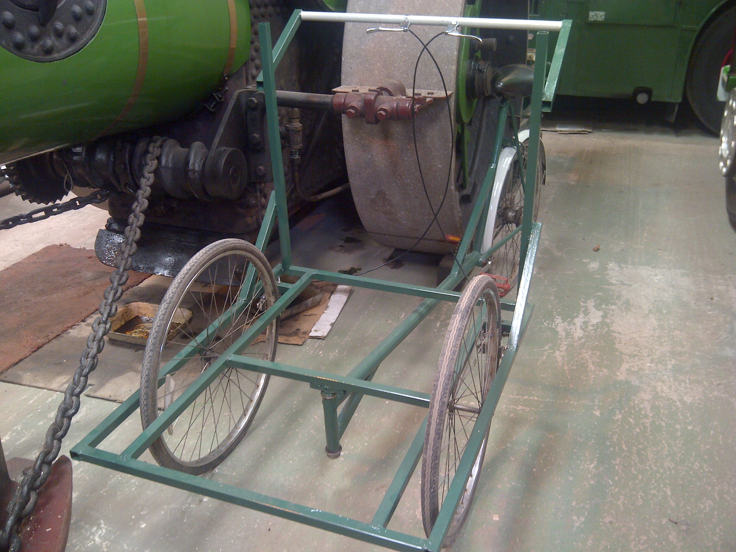With all the required modifications carried out, the tricycle frame was painted, first with red oxide primer, then with a dark green colour, which was from an old tin of paint obtained for free!