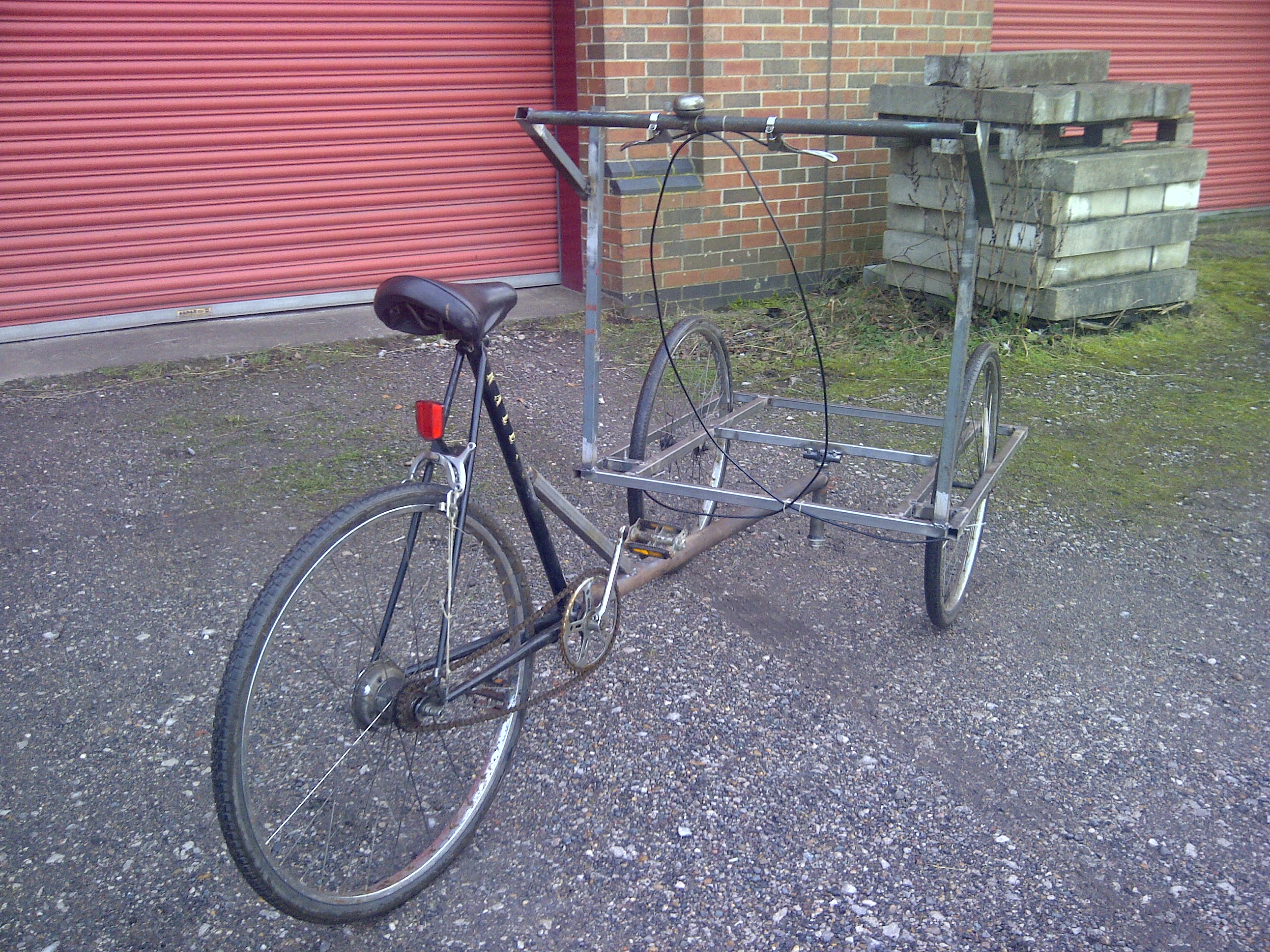The handlebar was made from steel tube and the brakes were added from the original bikes but fitted with new cables.
